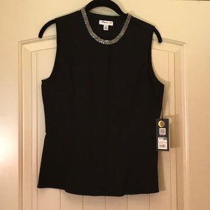 Black sleeveless peplum top..